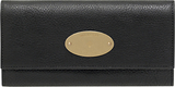 A chic wallet with two popper closures on the flap over closin...