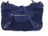 Balenciaga Balenciaga’s Classic Hip bag sees the label’s signature holdall scaled down. This navy-blue suede version is perfect for the new season lending a pop of colour to black and charcoal staples. Make it your go-to for low maintenance city style.