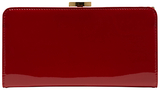 A beautifully elegant shiny patent leather purse from Lulu Gui...