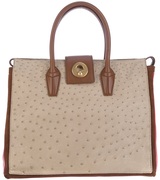 Red leather tote from Yves Saint Laurent featuring a top zip f...