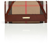 With its characteristic check and classic leather trim, Burber...
