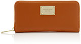 This zip-around wallet from MICHAEL Michael Kors is a sleek st...