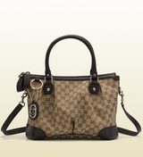 Beige/ebony original gg fabric with brown leather trim; light...